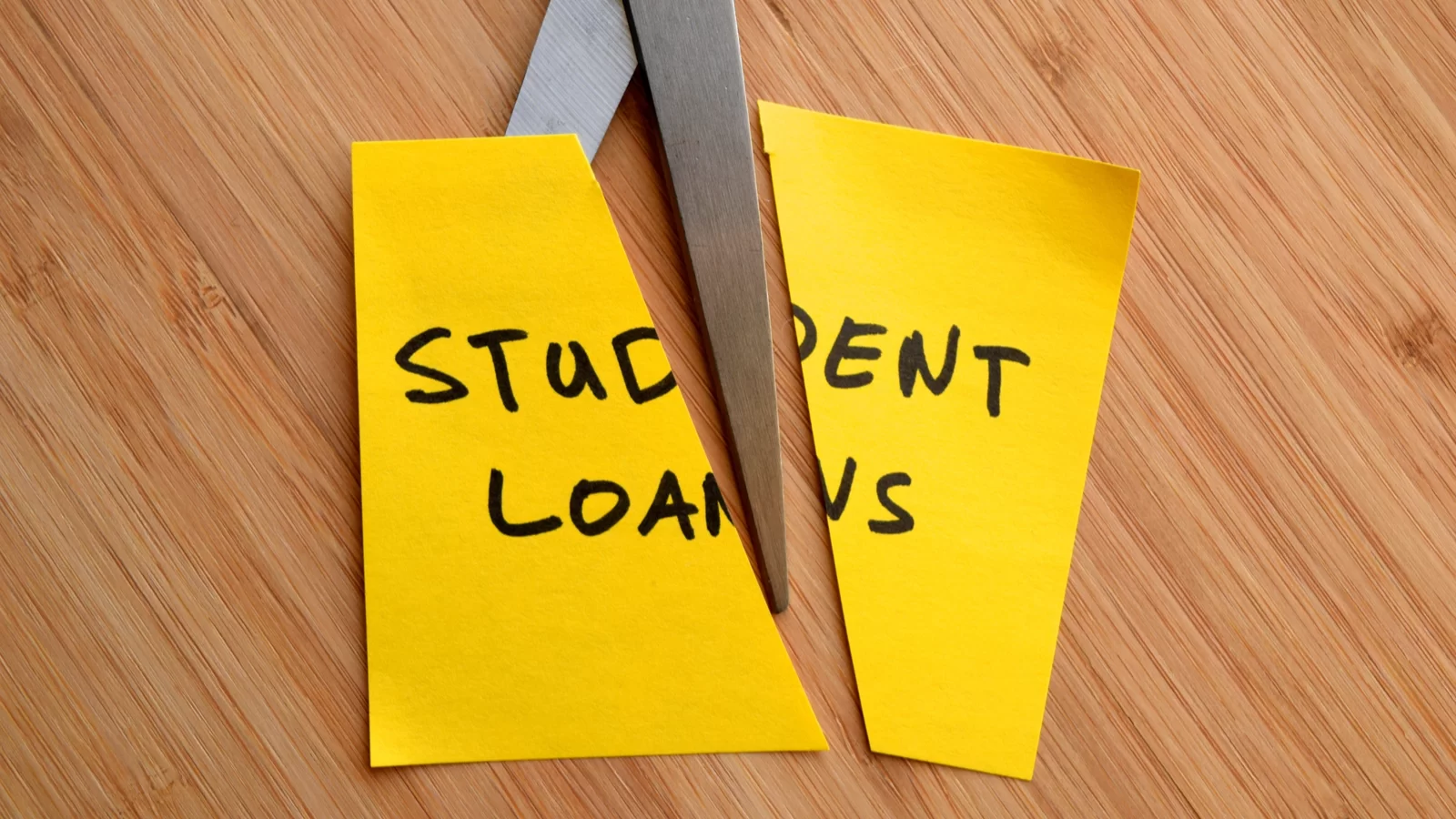 scissors-cutting-sticky-note-that-says-student-debt